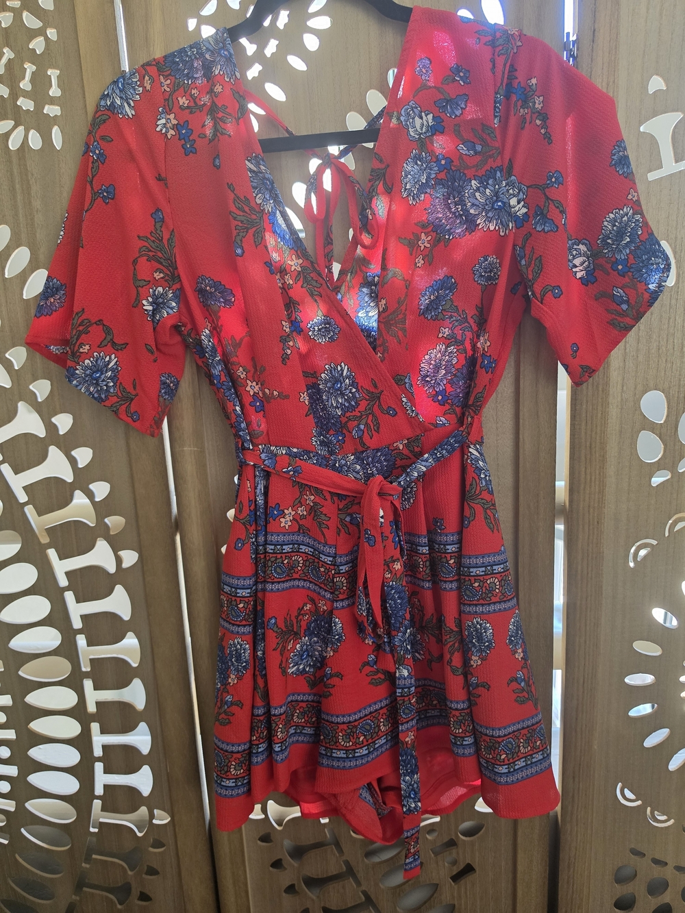 Francesca's Collections Floral Wrap V-Neck Short Sleeve Romper in Red